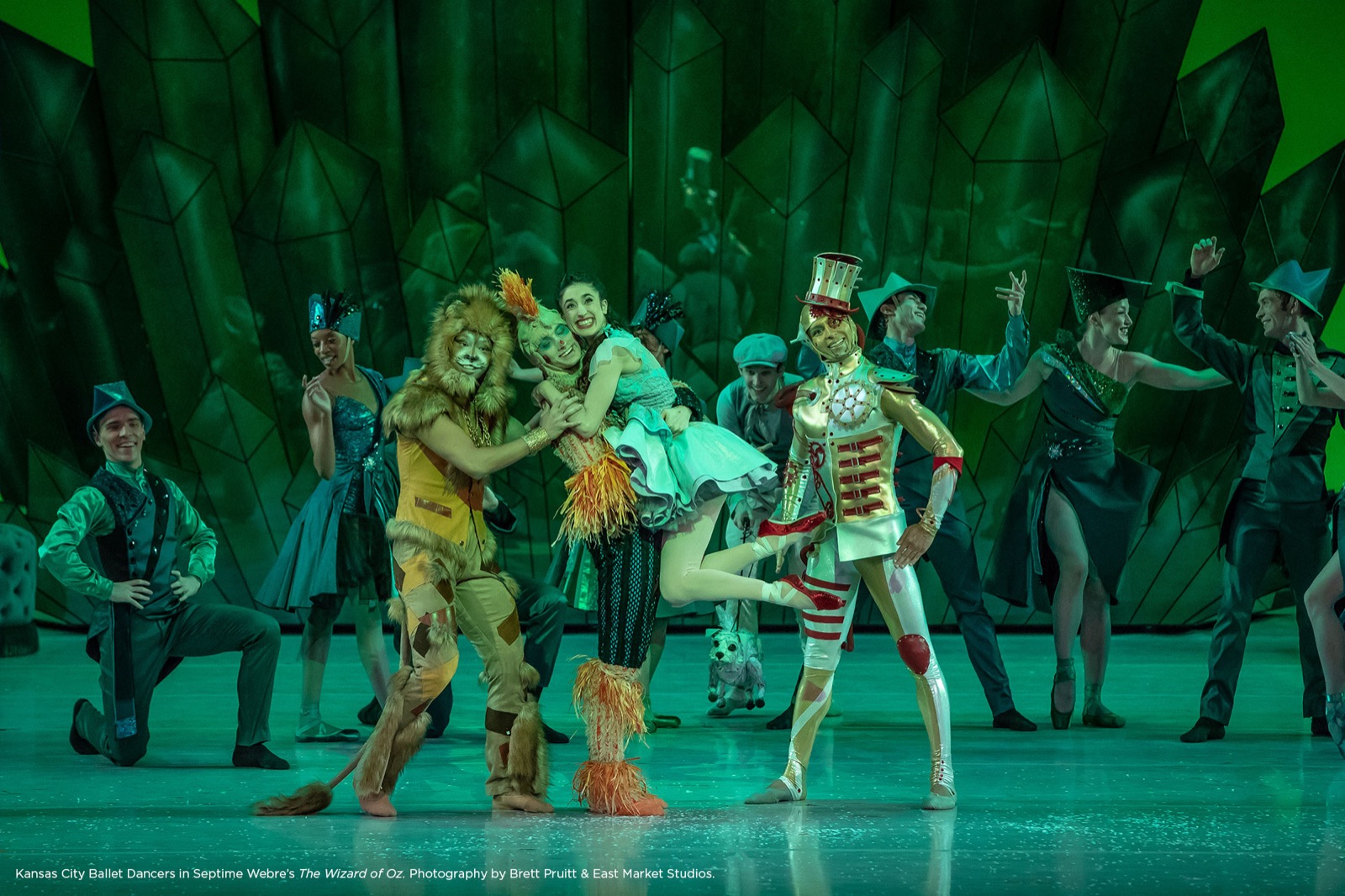 Kansas City Ballet dancers as Dorothy, the Lion, the Scarecrow, and the Tin Man in the Emerald City in Septime Webre's The Wizard of Oz. Photography by Brett Pruitt and East Market Studios.